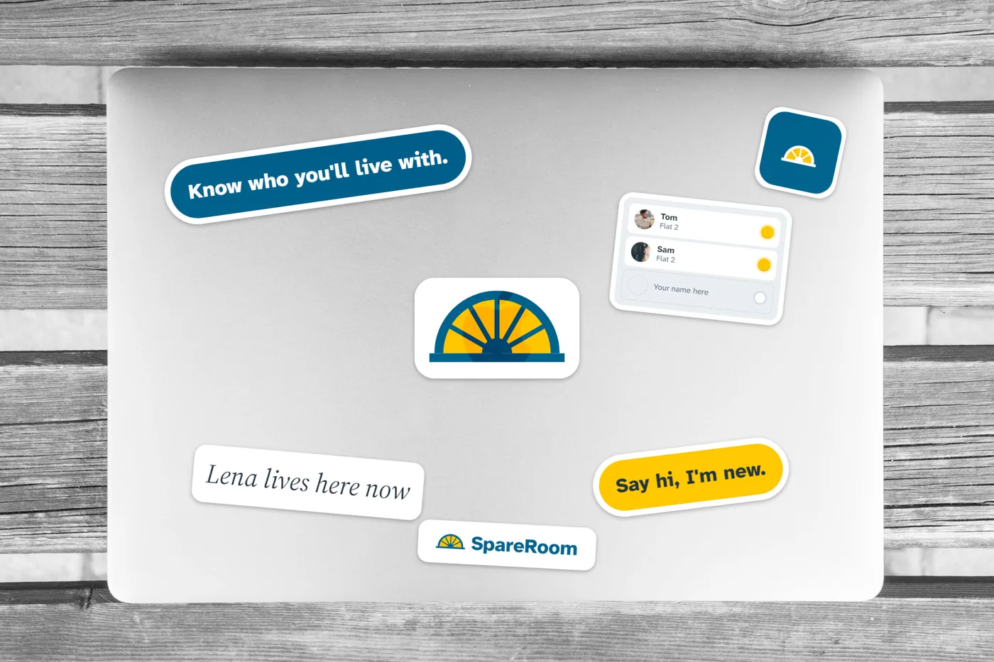 Laptop stickers: the tagline, the badge and a flatmate's line